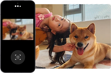 Dziewczynka leżąca obok psa widoczna w aplikacji do poprawy jakości zdjęć w smartfonie Xiaomi